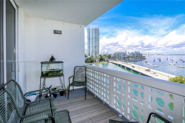 balcony featuring a water view