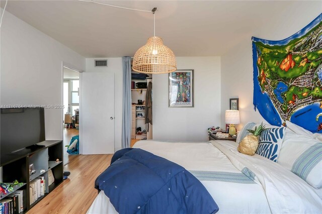 bedroom featuring hardwood / wood-style floors