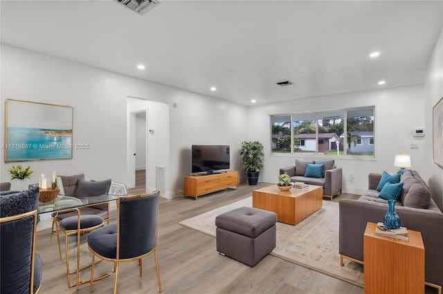 living room with light hardwood / wood-style flooring