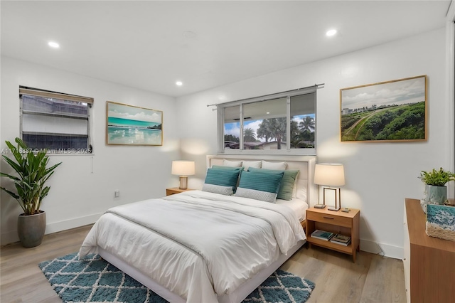 bedroom with light hardwood / wood-style floors