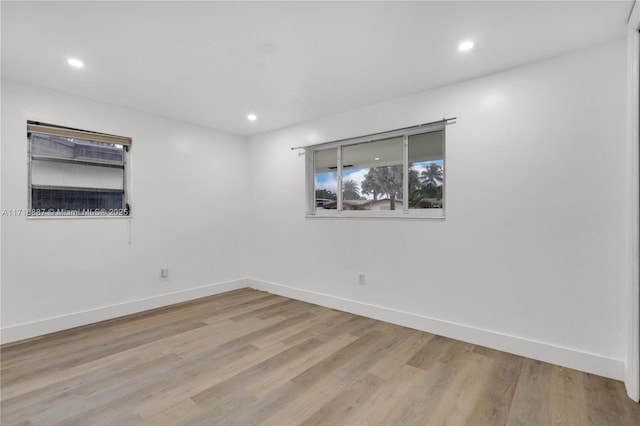 spare room with light wood-type flooring