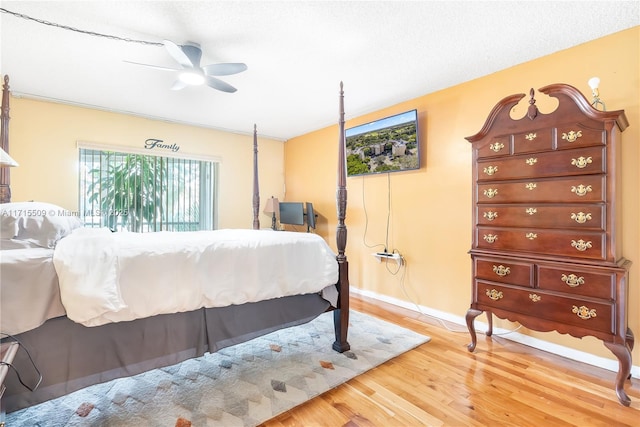 bedroom featuring ceiling fan and wood-type flooring