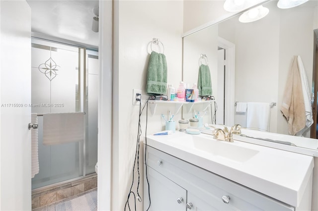 bathroom featuring vanity, toilet, and walk in shower