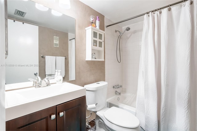 full bathroom featuring vanity, toilet, and shower / bathtub combination with curtain