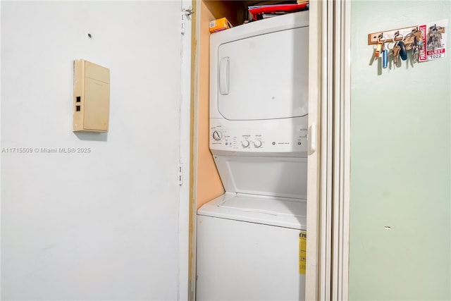 washroom with stacked washer and clothes dryer