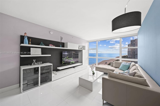 tiled living room with a wall of windows