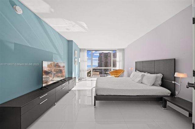 tiled bedroom with floor to ceiling windows