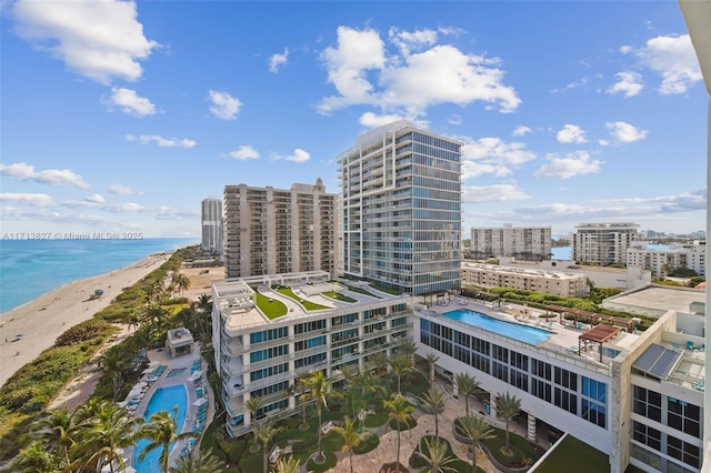 aerial view featuring a water view and a beach view