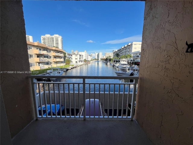 balcony featuring a water view