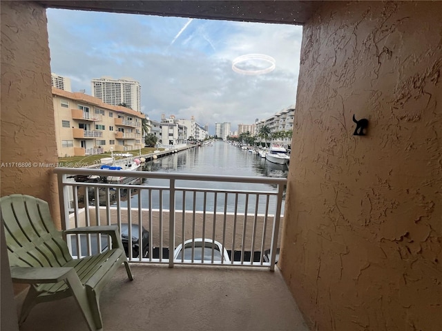 balcony featuring a water view