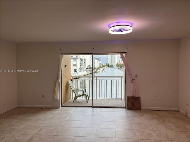 unfurnished room featuring light tile patterned floors