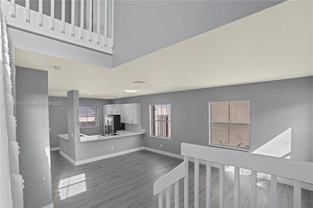 unfurnished living room featuring wood-type flooring