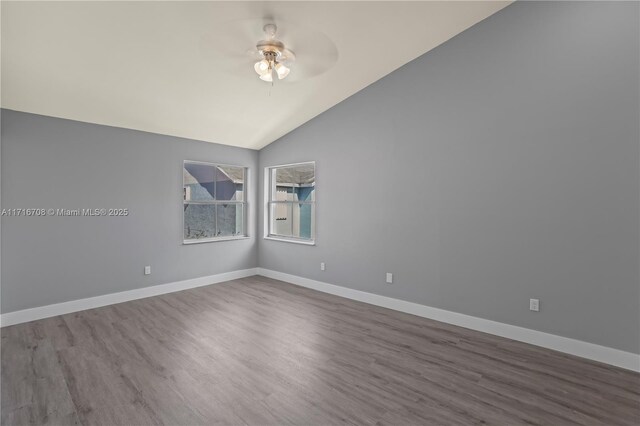 unfurnished room featuring hardwood / wood-style flooring, ceiling fan, and lofted ceiling