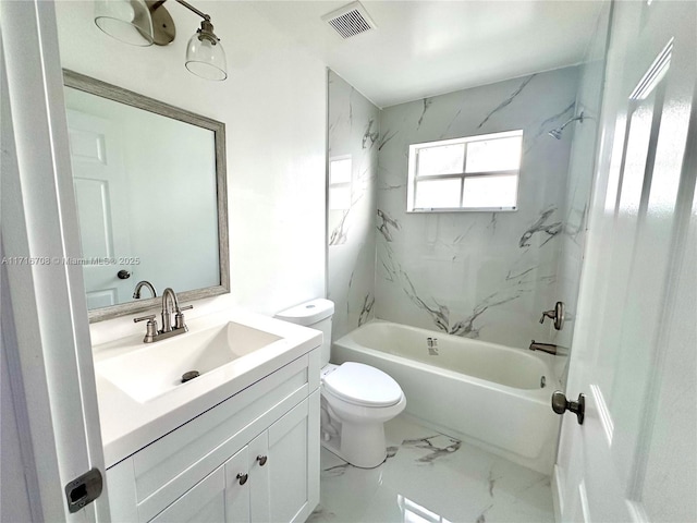 full bathroom with tiled shower / bath, vanity, and toilet