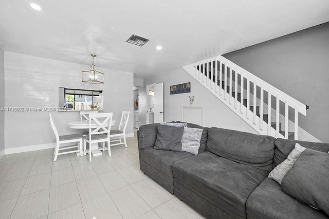 living room with a notable chandelier