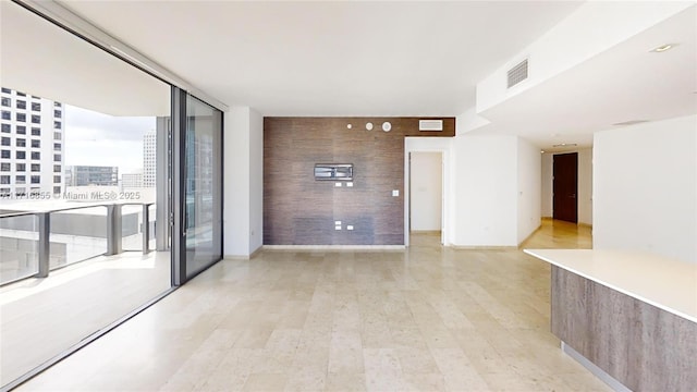 empty room with light hardwood / wood-style floors