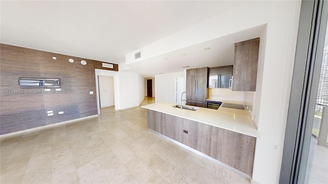 kitchen featuring sink and kitchen peninsula