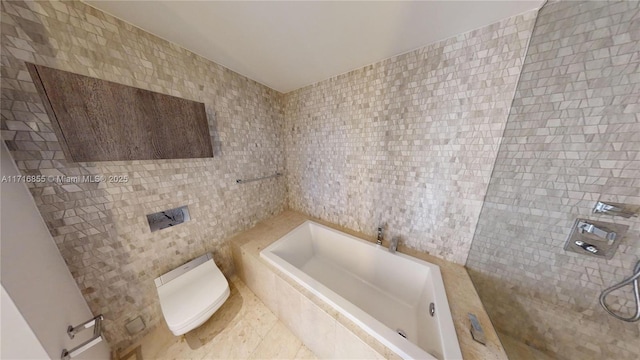 bathroom featuring tile walls and a washtub