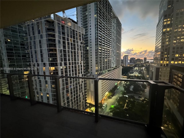 view of balcony at dusk