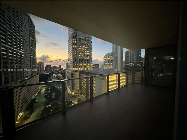 view of balcony at dusk