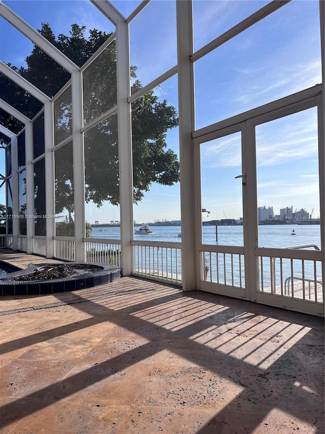 sunroom with a water view