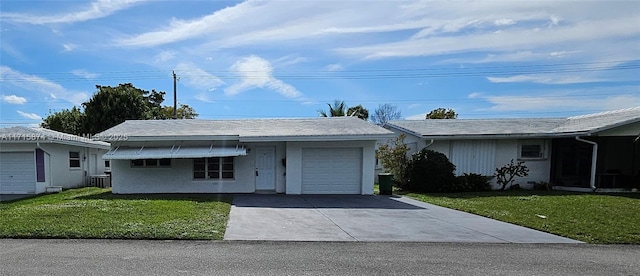 single story home with a front yard and a garage