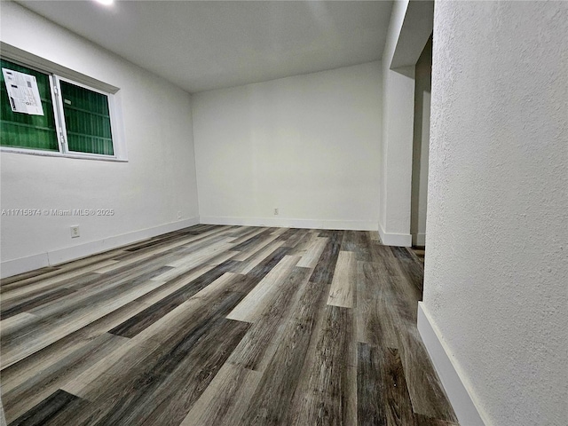 unfurnished room featuring hardwood / wood-style flooring