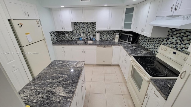 kitchen featuring white cabinetry, white appliances, sink, and tasteful backsplash