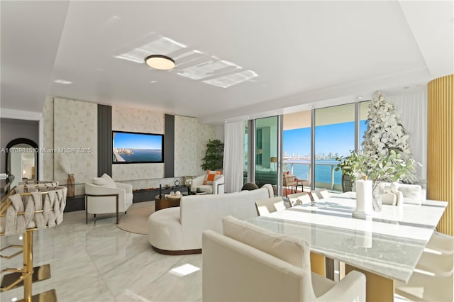 living room featuring floor to ceiling windows