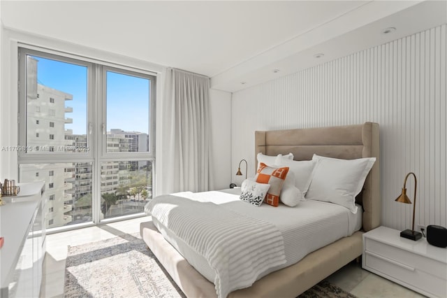 bedroom with a wall of windows