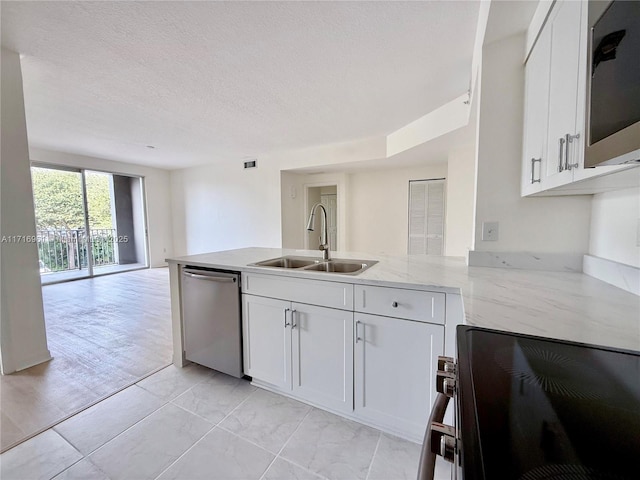 kitchen with sink, white cabinetry, light stone countertops, stainless steel dishwasher, and kitchen peninsula