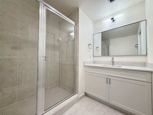 bathroom with vanity and an enclosed shower