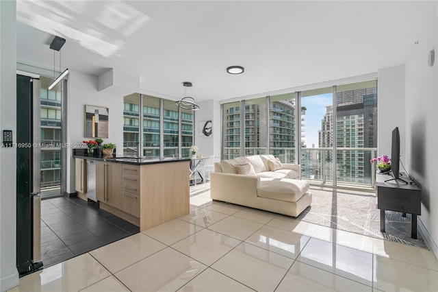 living room with light tile patterned floors and expansive windows