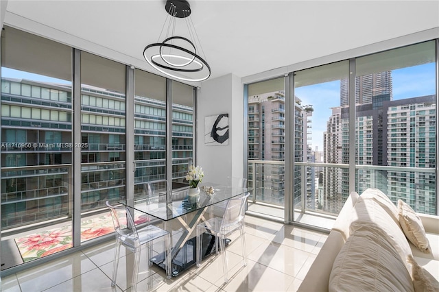 sunroom / solarium featuring a view of city