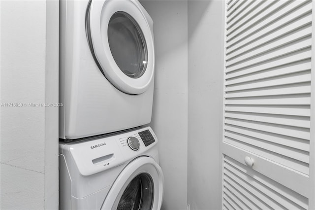 washroom with laundry area and stacked washer and dryer