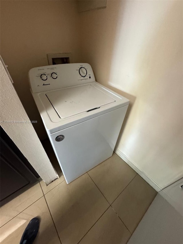 washroom featuring washer / dryer and tile patterned floors