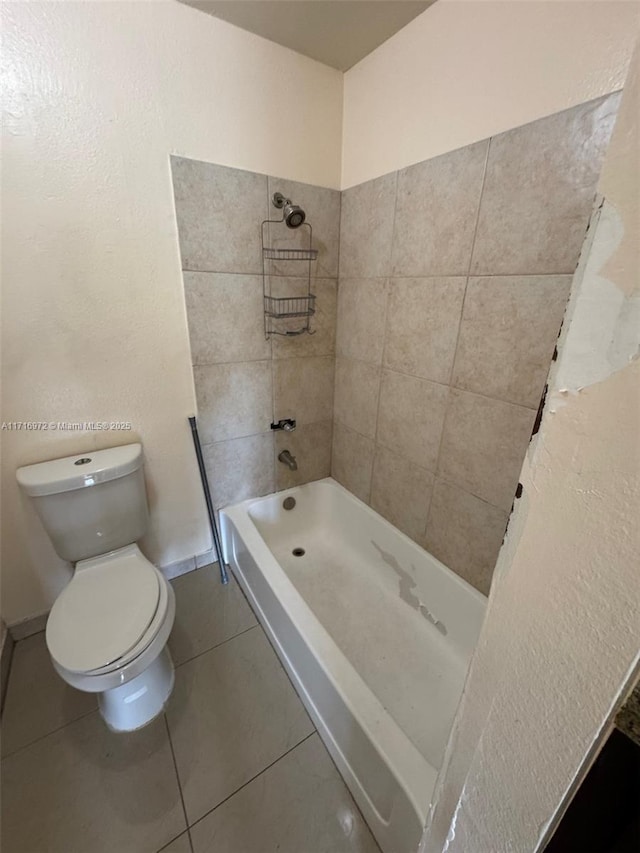 bathroom with tile patterned flooring, toilet, and plus walk in shower