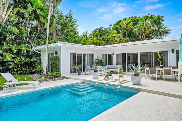 view of pool with a patio area and an outdoor hangout area