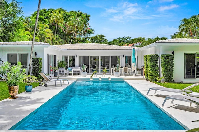 view of swimming pool featuring a patio area