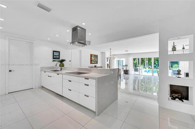 kitchen featuring white cabinetry, a notable chandelier, island exhaust hood, black electric cooktop, and light tile patterned flooring