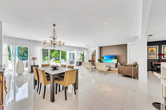 tiled dining area with a chandelier