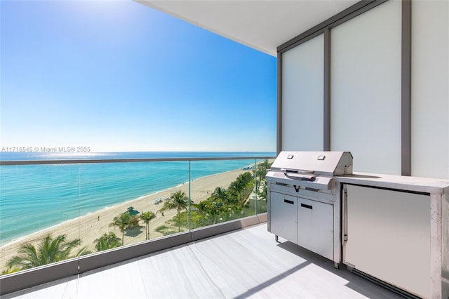 balcony with a beach view and a water view