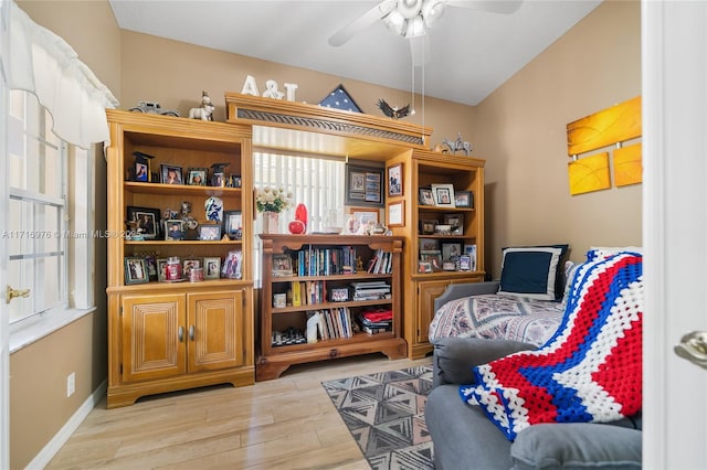 sitting room featuring baseboards, ceiling fan, and wood finished floors