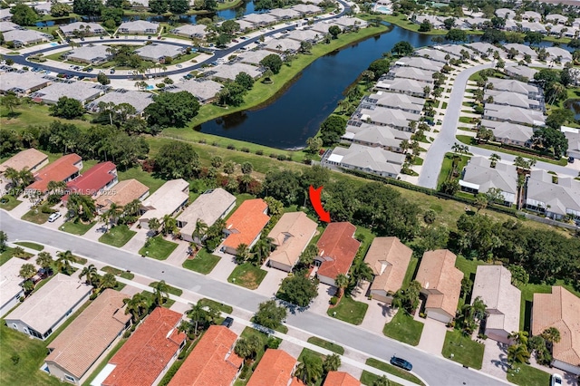 bird's eye view featuring a residential view and a water view