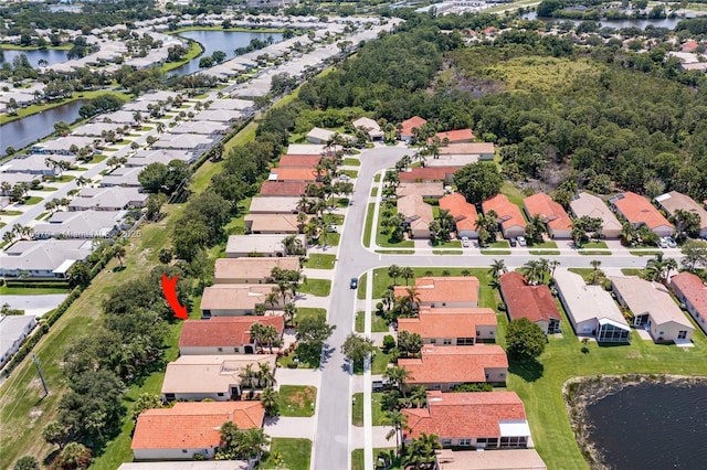 birds eye view of property featuring a water view and a residential view