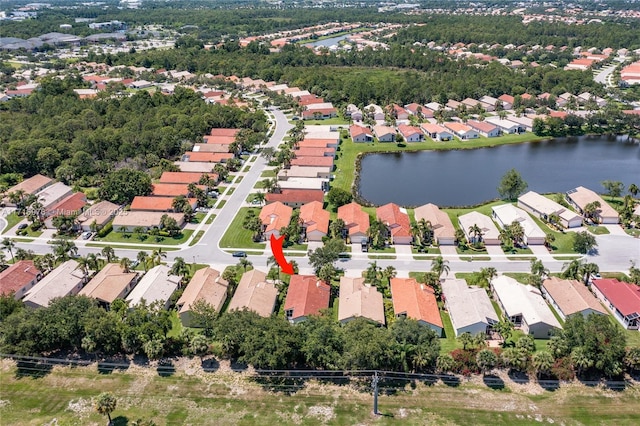 drone / aerial view with a residential view and a water view