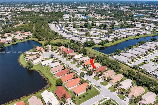 birds eye view of property featuring a residential view and a water view