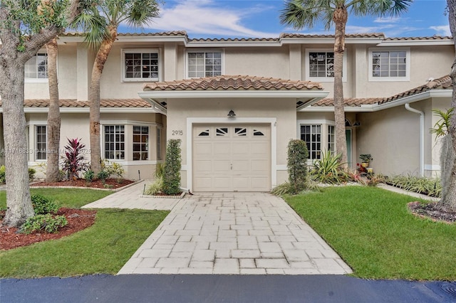 mediterranean / spanish-style house featuring a garage