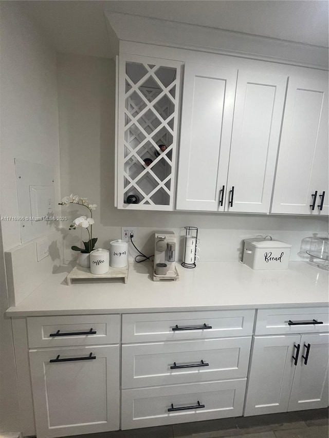 bar with white cabinetry