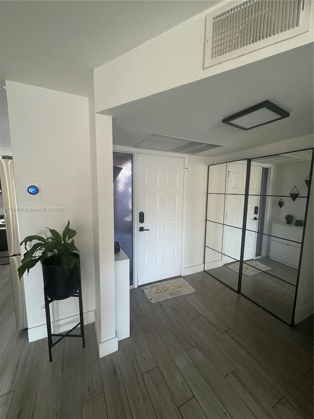 foyer with dark wood-type flooring